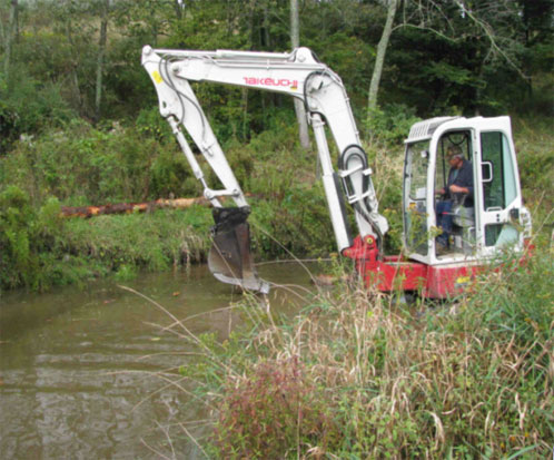 Earth-moving equipment works on stream habitat restoration in Centre County's Elk Creek